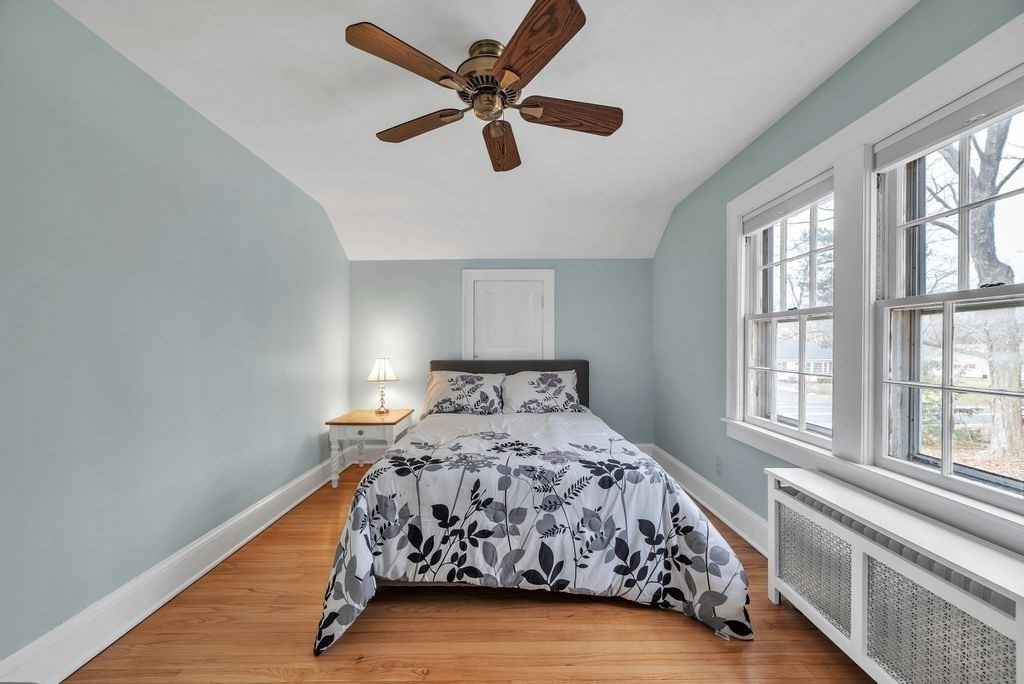 106 Granville Road Westfield, MA 01085 - Photo 35 of 42 a bed sitting in a bedroom next to a window