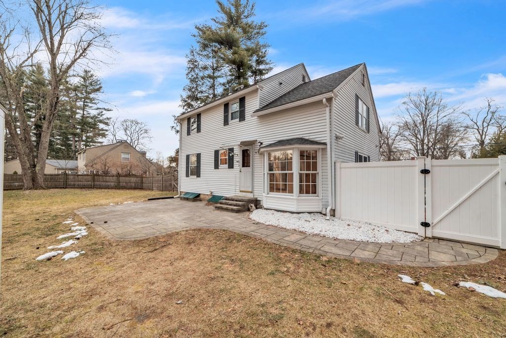 106 Granville Road Westfield, MA 01085 - Photo 5 of 42 a view of a white house with a large tree in front of it
