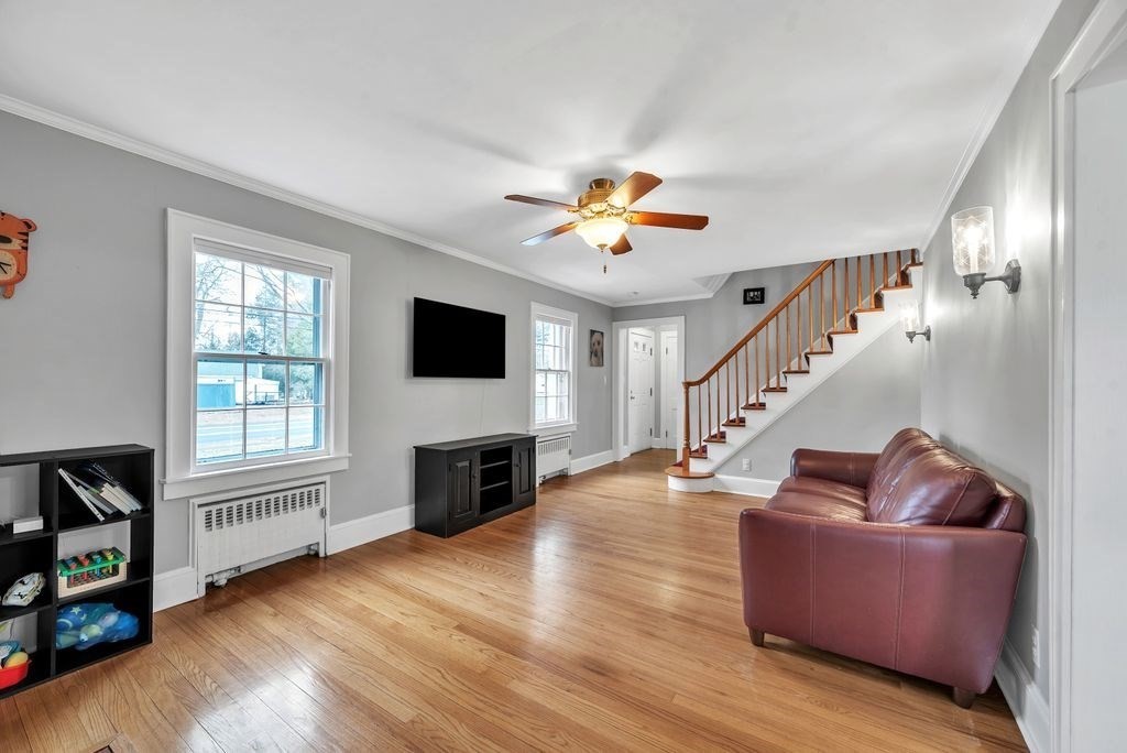 106 Granville Road Westfield, MA 01085 - Photo 10 of 42 a living room with furniture and a flat screen tv with wooden floor