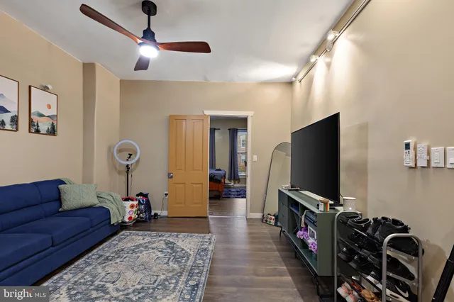 a kitchen with a sink cabinets and wooden floor