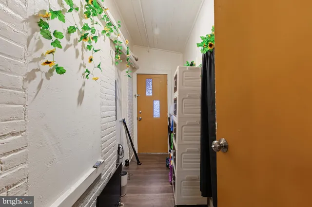 a view of entryway with wooden floor