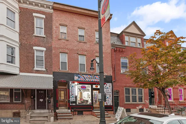 a front view of a building with glass windows