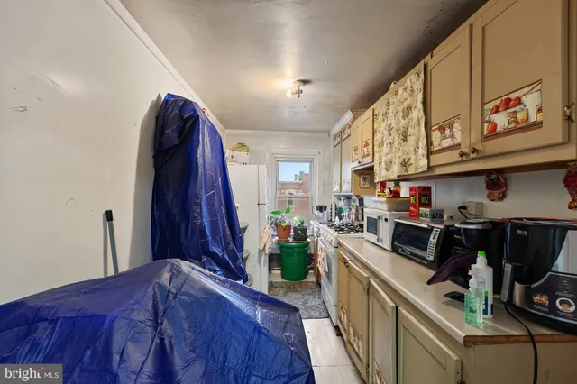 a bathroom with a toilet a sink and a window