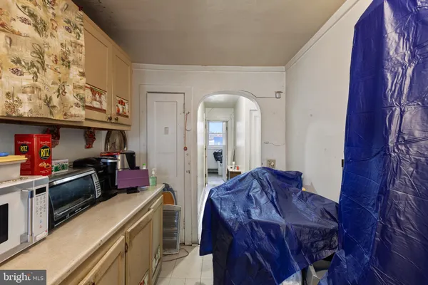 a bedroom with a bed dresser and a window