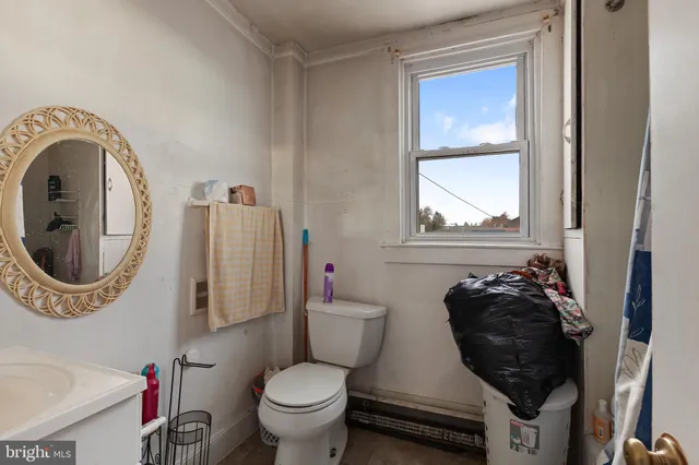 a bed sitting in a bedroom and a flat screen tv