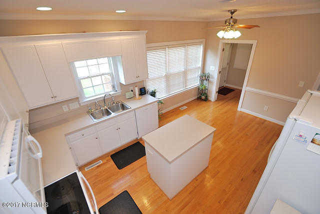 3518 Carriage Farm Road Rocky Mount, NC 27804 - Photo 29 of 39 Hardwood floors in kitchen