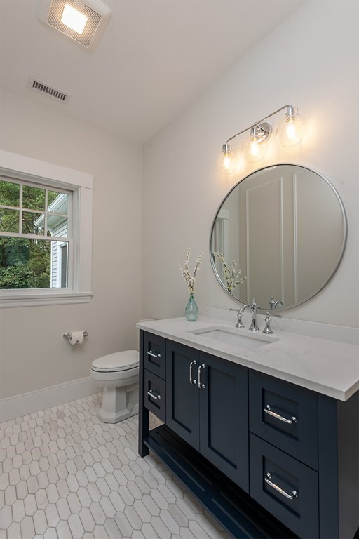 40 Rocky Hill Road Andover, MA 01810 - Photo 16 of 41 a bathroom with a toilet sink and mirror