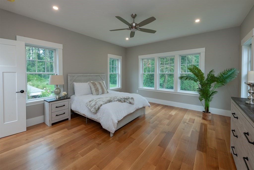 40 Rocky Hill Road Andover, MA 01810 - Photo 20 of 41 a spacious bedroom with a large bed and a large window