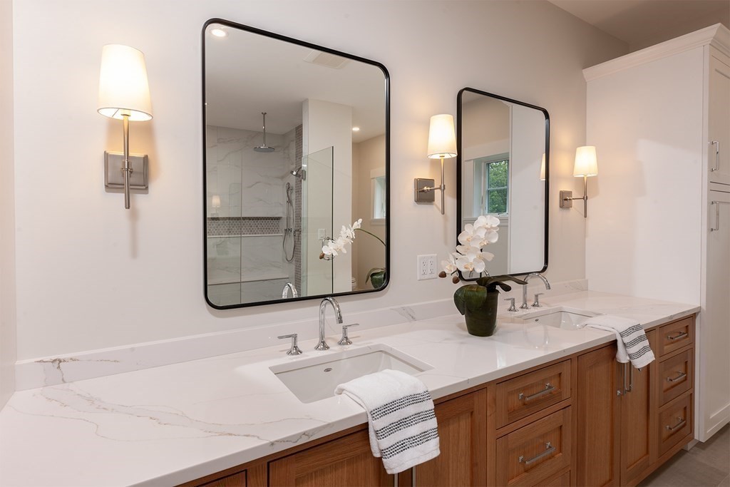 40 Rocky Hill Road Andover, MA 01810 - Photo 21 of 41 a bathroom with double vanity sinks and a mirror