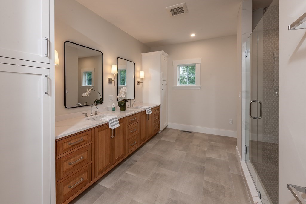 40 Rocky Hill Road Andover, MA 01810 - Photo 22 of 41 a bathroom with a double vanity sink and a mirror