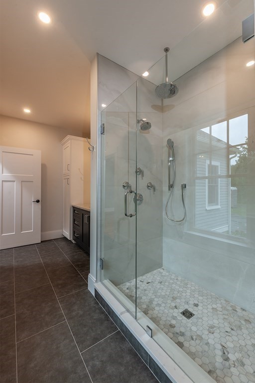 40 Rocky Hill Road Andover, MA 01810 - Photo 25 of 41 a bathroom with a glass shower door and a glass door