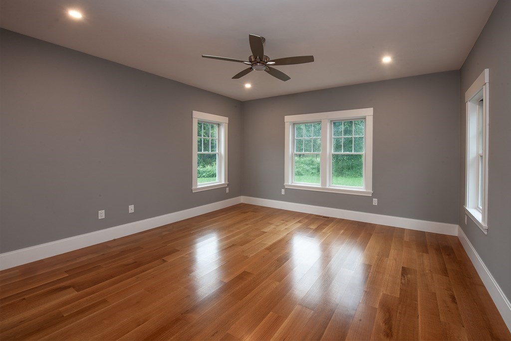 40 Rocky Hill Road Andover, MA 01810 - Photo 26 of 41 a view of an empty room with wooden floor and a window