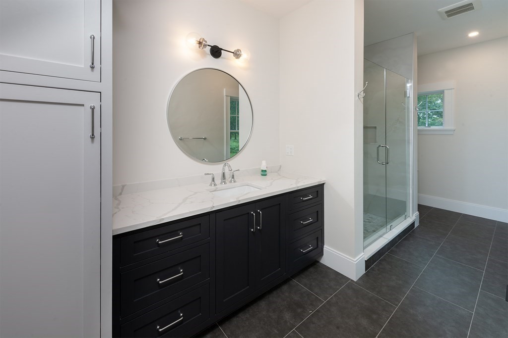 40 Rocky Hill Road Andover, MA 01810 - Photo 28 of 41 a bathroom with a double vanity sink and mirror