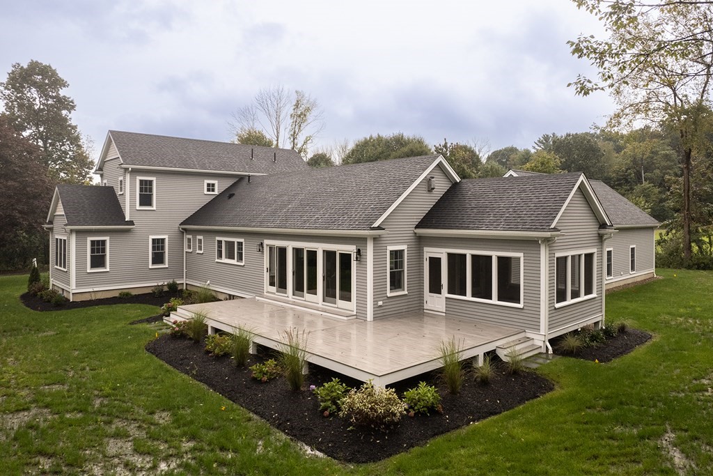 40 Rocky Hill Road Andover, MA 01810 - Photo 3 of 41 an aerial view of a house with yard and trees in the background