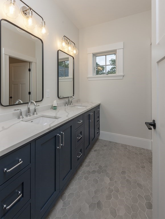 40 Rocky Hill Road Andover, MA 01810 - Photo 32 of 41 a spacious bathroom with a double vanity sink and a mirror