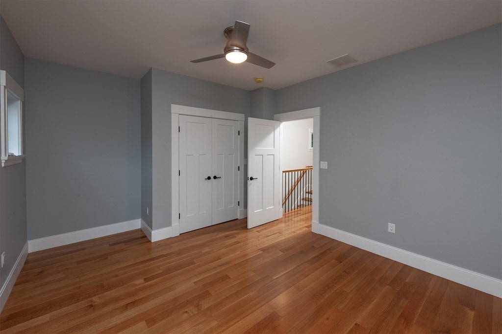40 Rocky Hill Road Andover, MA 01810 - Photo 34 of 41 wooden floor in an empty room with a window