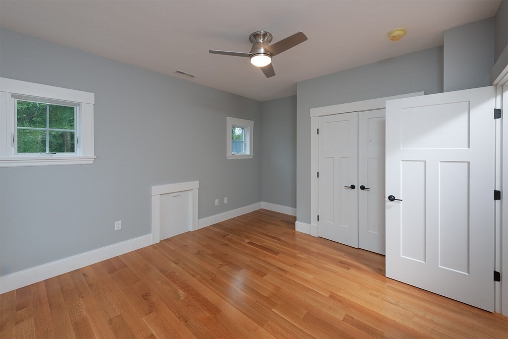 40 Rocky Hill Road Andover, MA 01810 - Photo 35 of 41 a view of empty room with wooden floor and ceiling fan