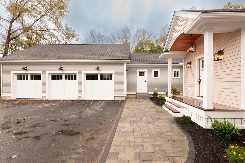 40 Rocky Hill Road Andover, MA 01810 - Photo 41 of 41 a front view of a house with a yard and garage