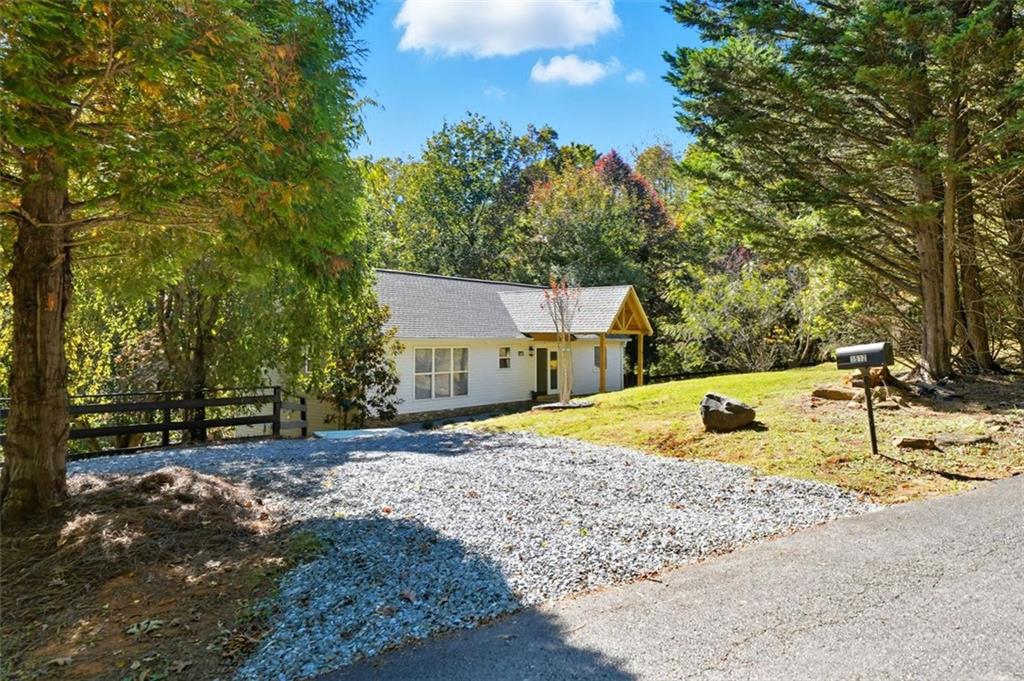 1512 Upper Sassafras Road Jasper, GA 30143 - Photo 33 of 41 a view of a house with a yard and sitting area