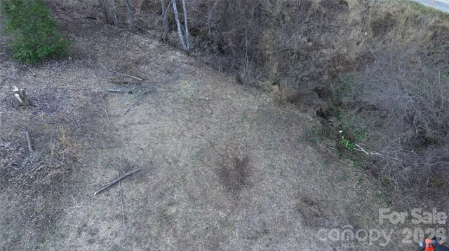 a view of a dry yard with a sink