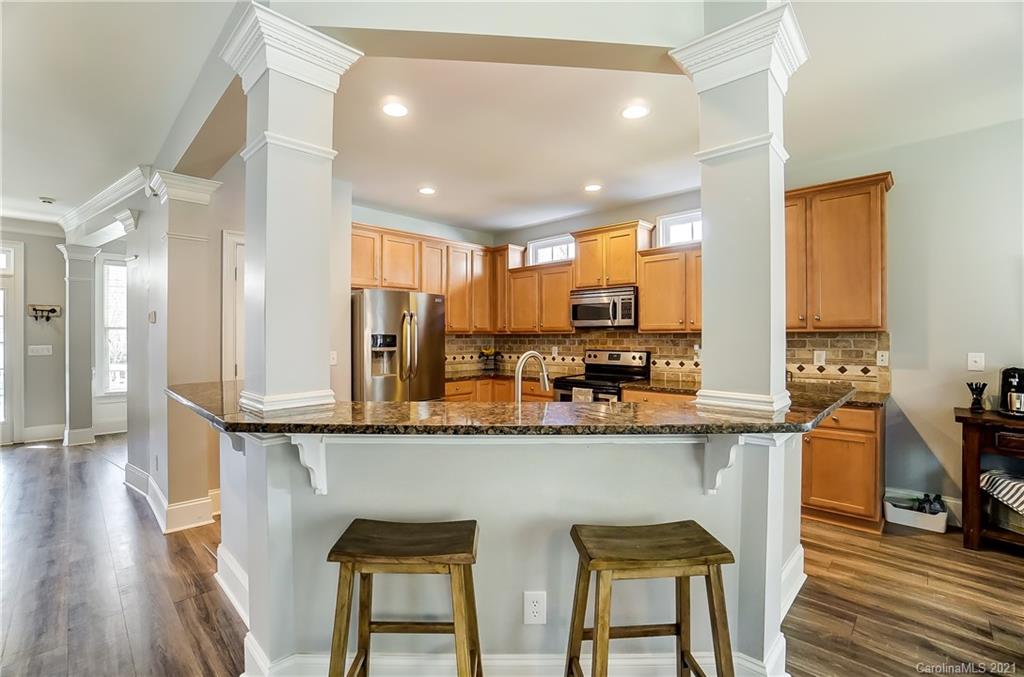 3284 Richard's Crossing Fort Mill, SC 29708 - Photo 12 of 43 a kitchen with stainless steel appliances granite countertop counter space a sink and cabinets