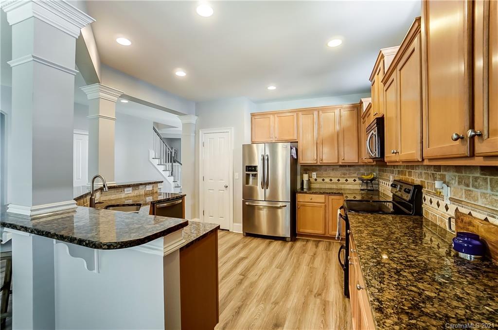 3284 Richard's Crossing Fort Mill, SC 29708 - Photo 13 of 43 a kitchen with refrigerator and stove