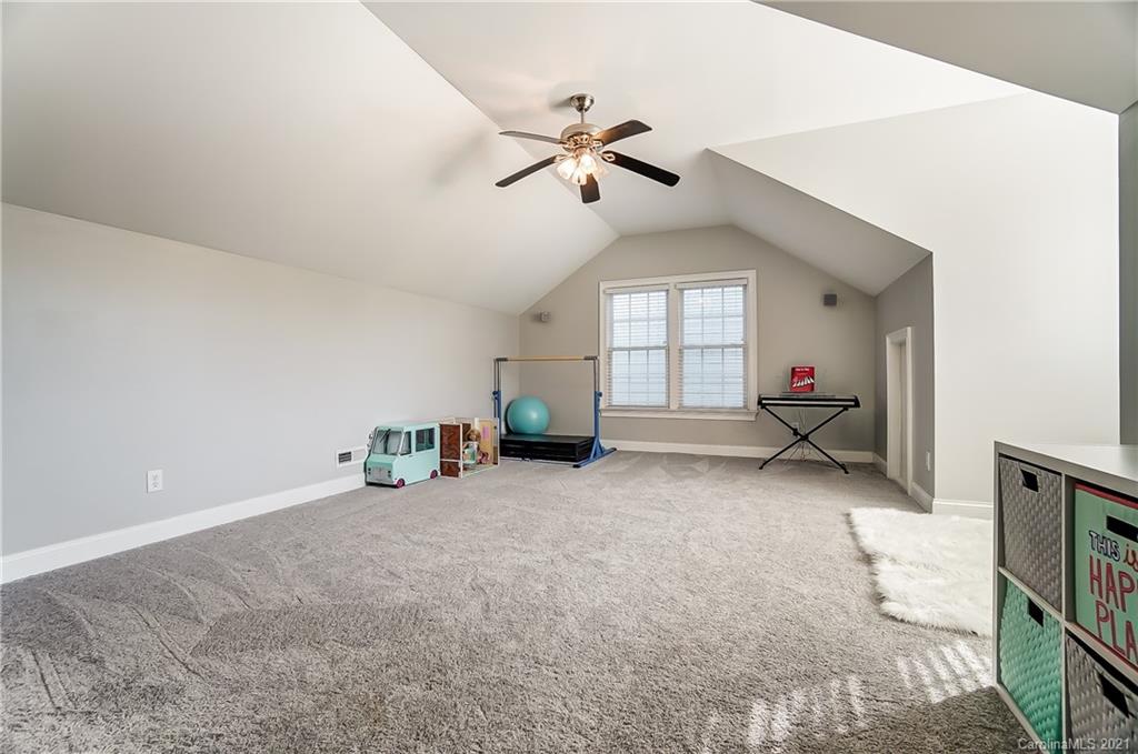 3284 Richard's Crossing Fort Mill, SC 29708 - Photo 21 of 43 a view of a livingroom with a ceiling fan and window