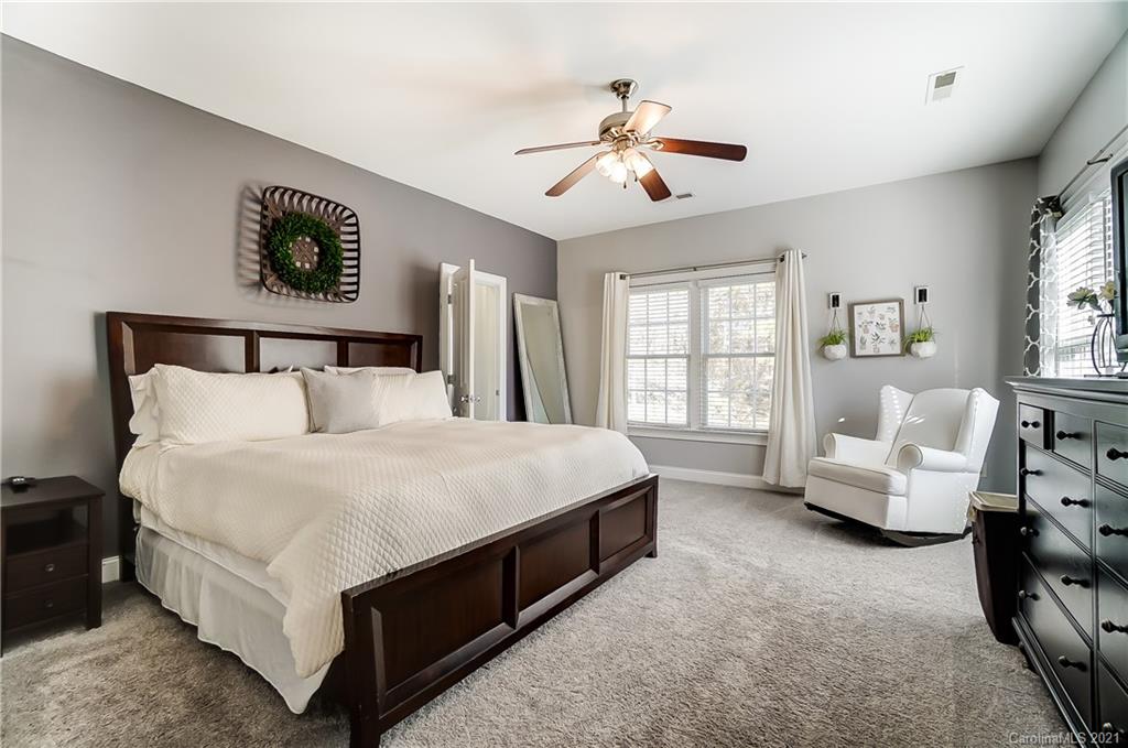 3284 Richard's Crossing Fort Mill, SC 29708 - Photo 24 of 43 a bed room with a bed and a chandelier