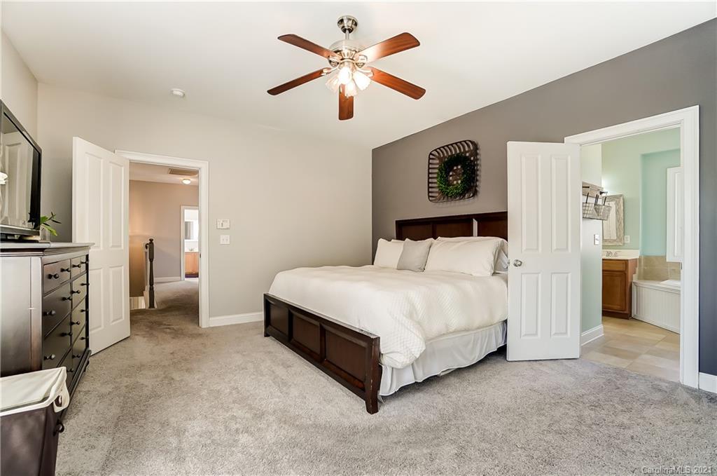 3284 Richard's Crossing Fort Mill, SC 29708 - Photo 25 of 43 a bedroom with a bed and a ceiling fan