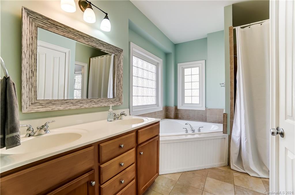 3284 Richard's Crossing Fort Mill, SC 29708 - Photo 27 of 43 a bathroom with a sink double vanity mirror and a bathtub