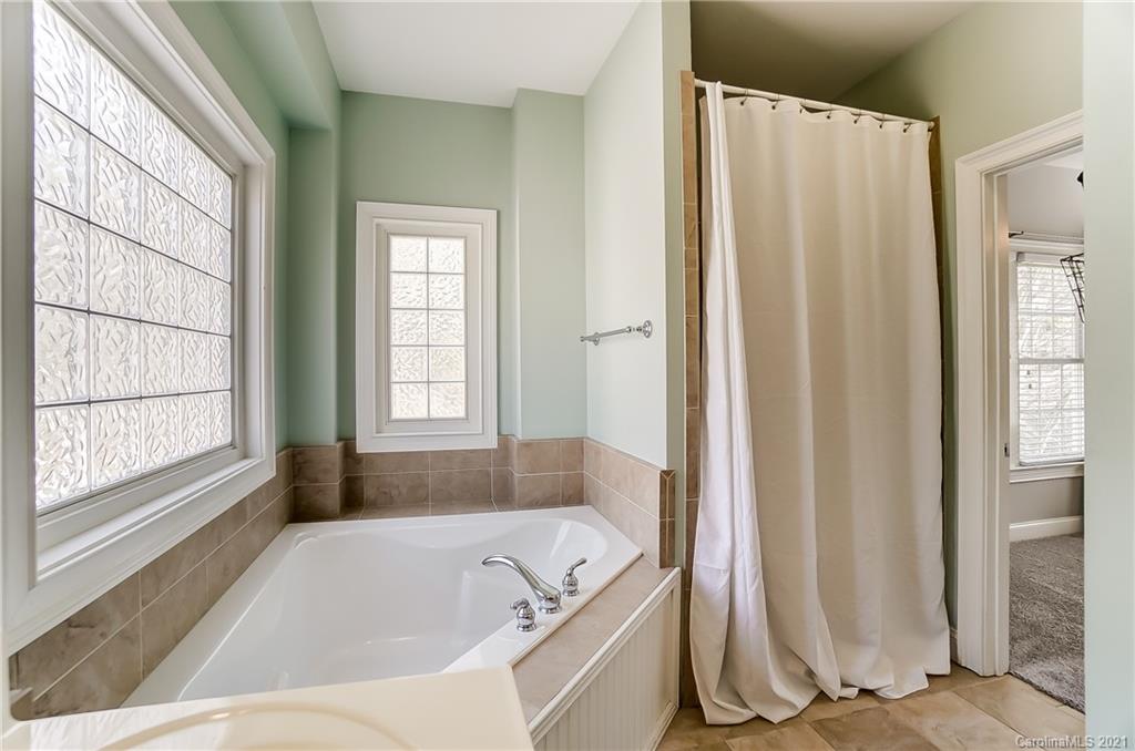 3284 Richard's Crossing Fort Mill, SC 29708 - Photo 28 of 43 a bath tub sitting in a bathroom next to a window