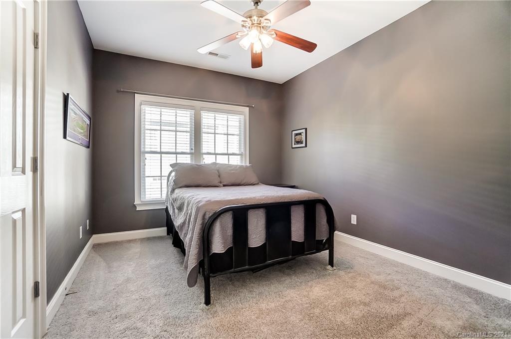 3284 Richard's Crossing Fort Mill, SC 29708 - Photo 32 of 43 a bed sitting in a bedroom next to a window