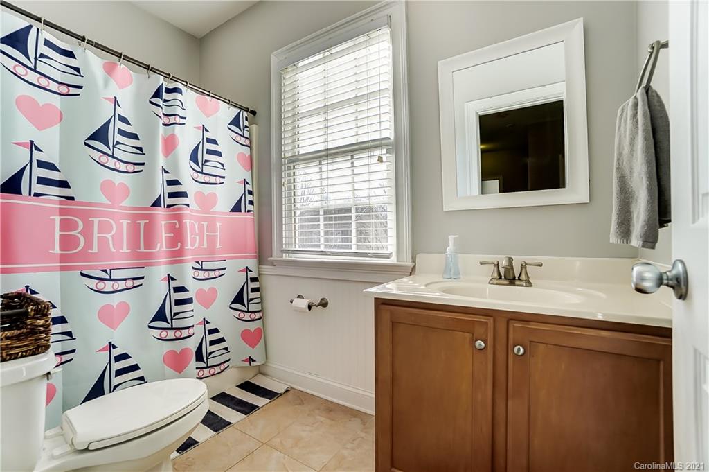 3284 Richard's Crossing Fort Mill, SC 29708 - Photo 34 of 43 a bathroom with a sink and mirror with toilet