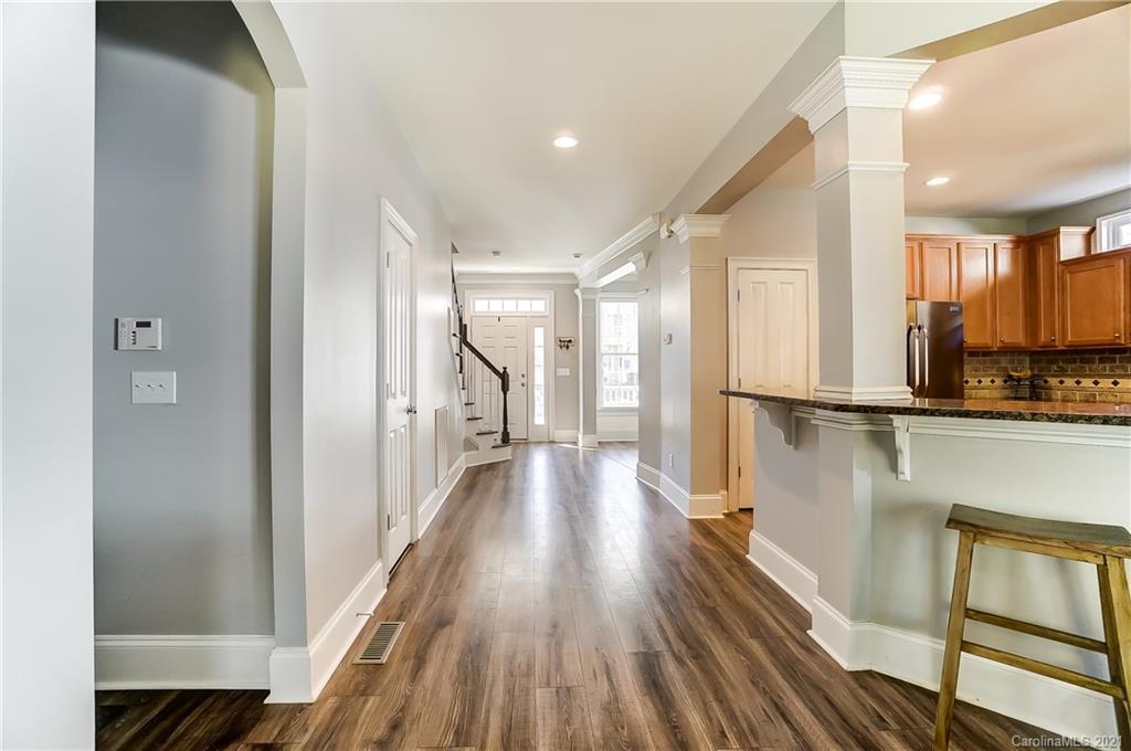 3284 Richard's Crossing Fort Mill, SC 29708 - Photo 6 of 43 a view of a hallway with wooden floor and staircase