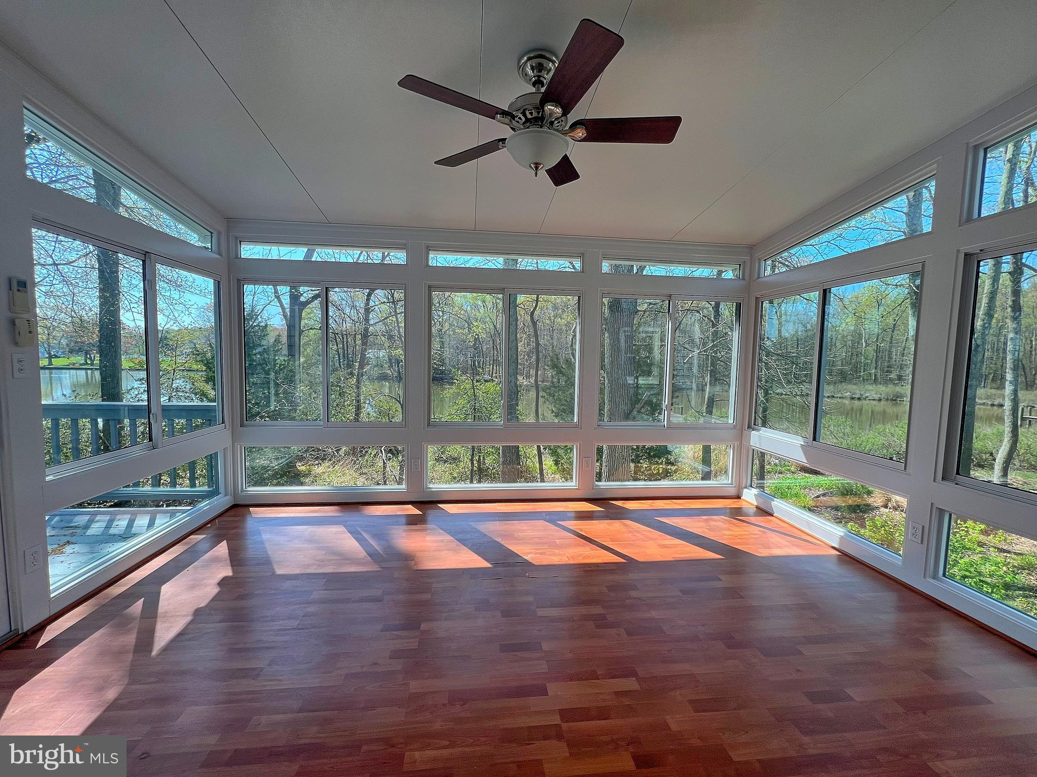 5629 Gunner Run Road Churchton, MD 20733 - Photo 23 of 51 a view of empty room with wooden floor and fan