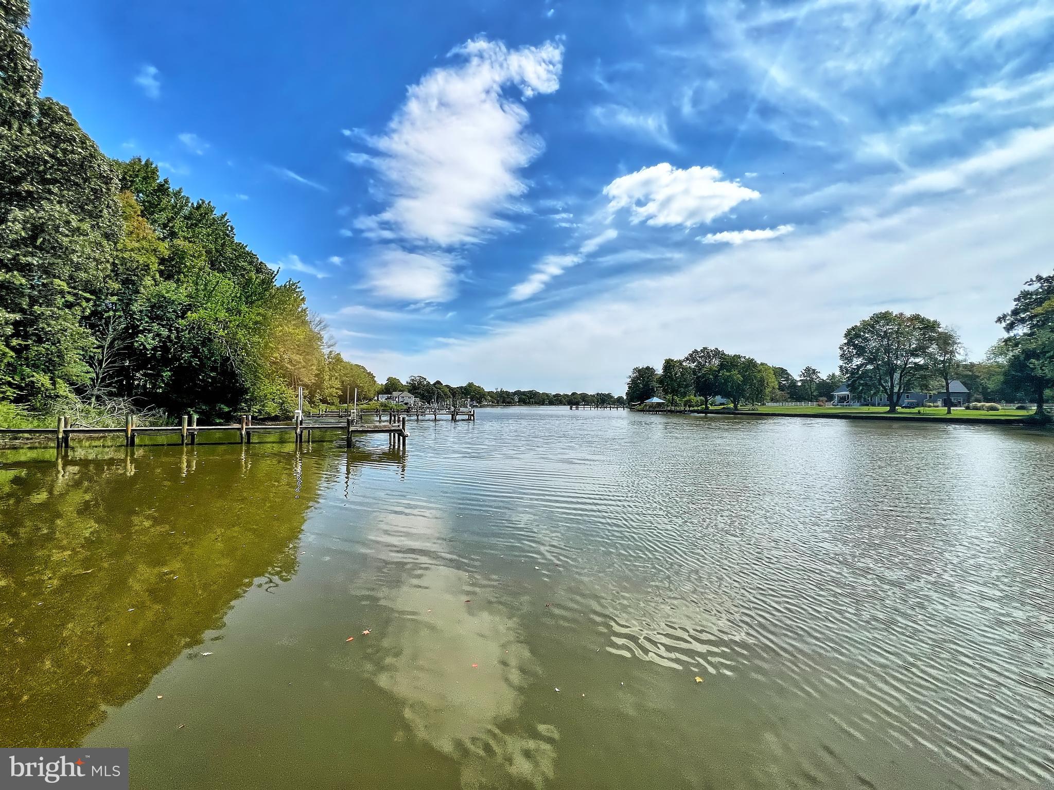 5629 Gunner Run Road Churchton, MD 20733 - Photo 3 of 51 a view of a lake with couches in the background