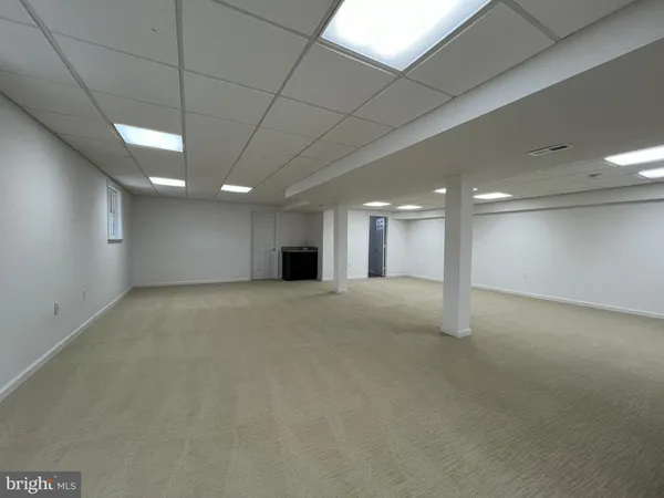 a bathroom with a toilet a sink and shower