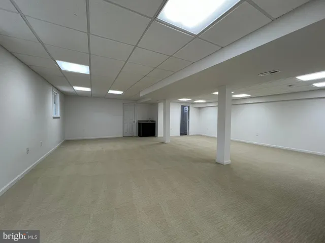 a bathroom with a toilet a sink and shower