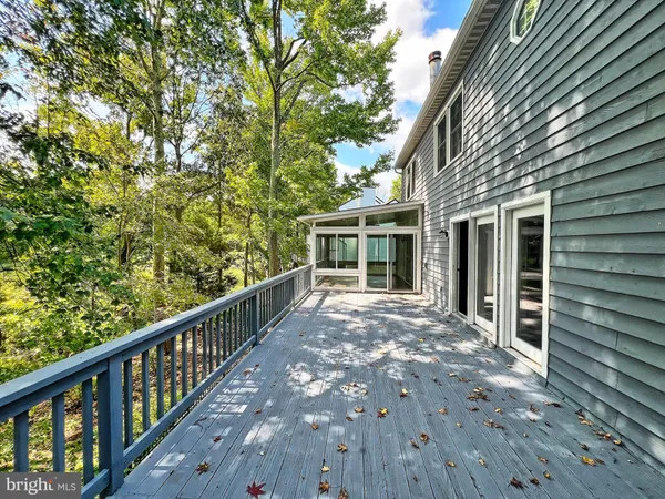 a view of a lake with boats and trees in the background