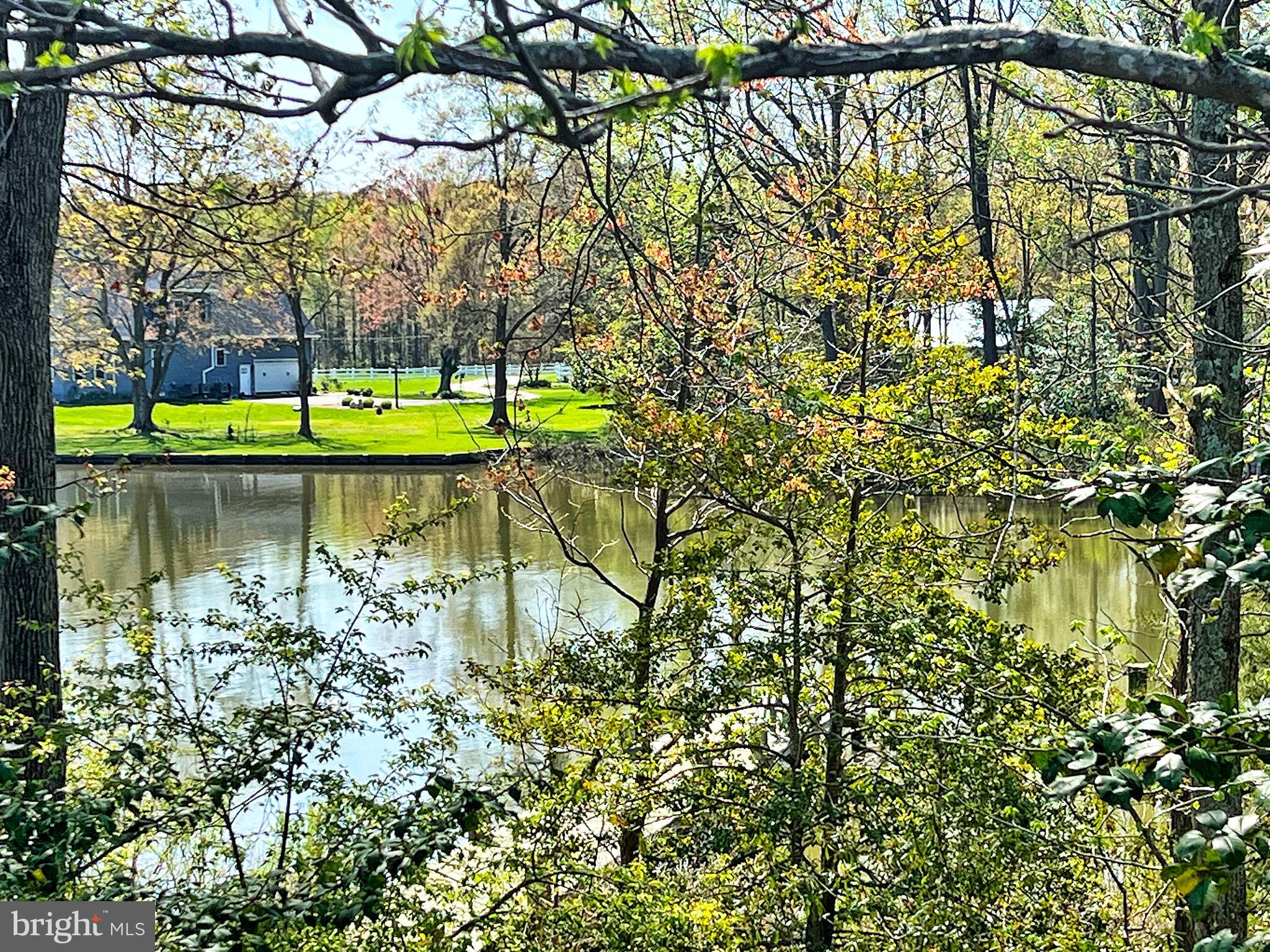 5629 Gunner Run Road Churchton, MD 20733 - Photo 49 of 51 a swimming pool with trees in the background