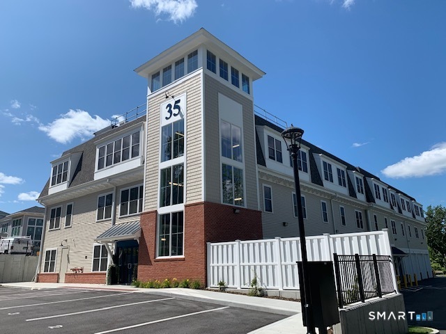 35 Old Quarry Road, Unit C8 Ridgefield, CT 06877 - Photo 14 of 15 a front view of a building with a street