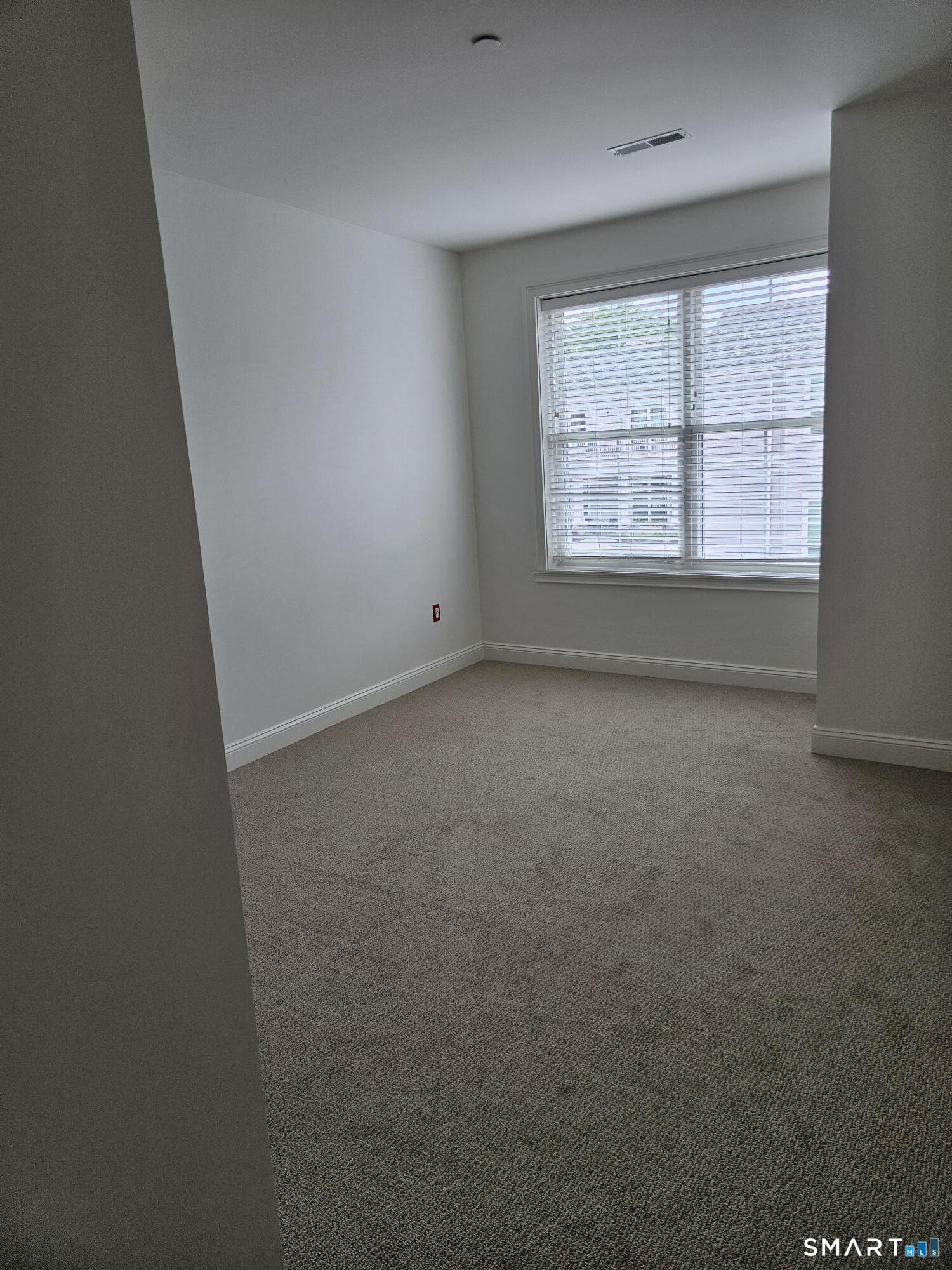 35 Old Quarry Road, Unit C8 Ridgefield, CT 06877 - Photo 10 of 15 an empty room with a window
