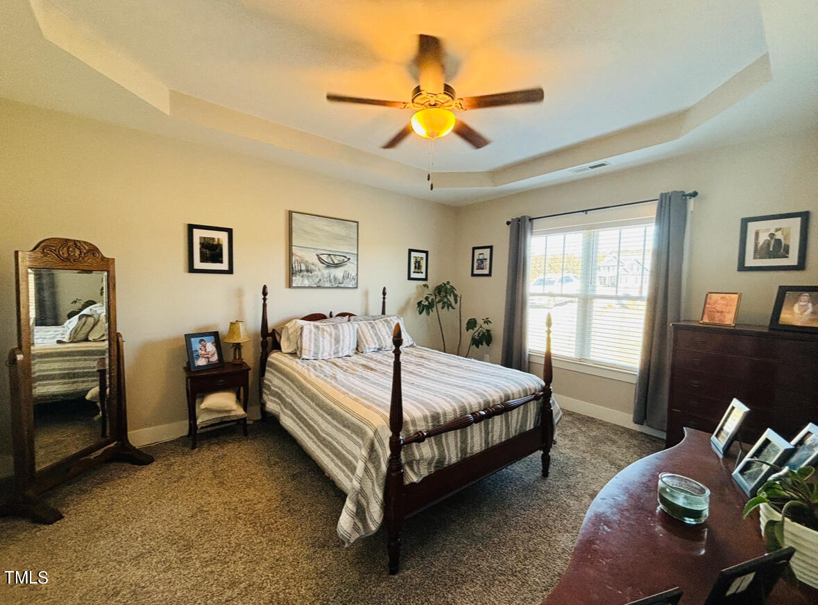 2510 Nc 55 Dunn, NC 28334 - Photo 7 of 13 a bed room with a bed and a tv