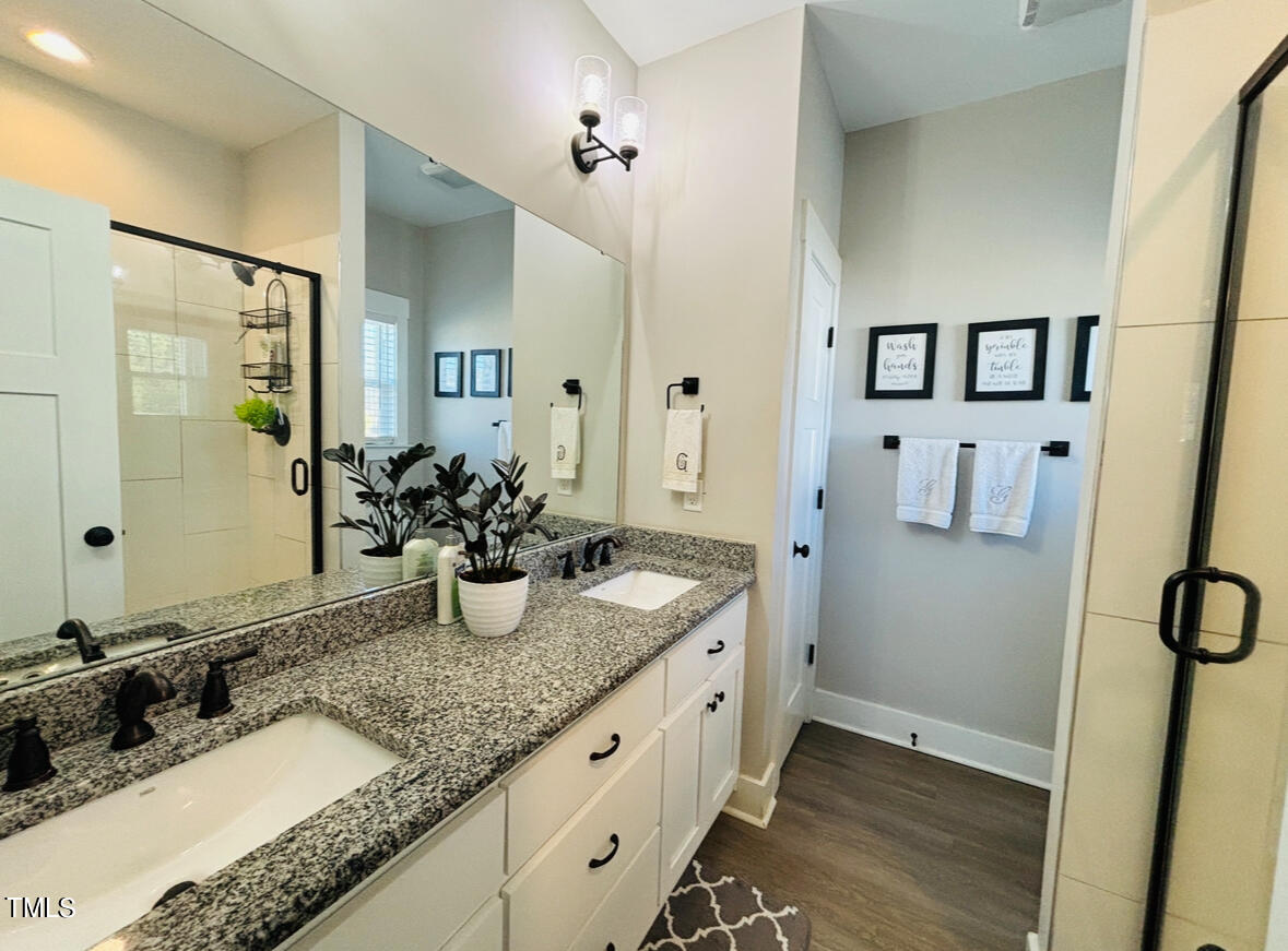 2510 Nc 55 Dunn, NC 28334 - Photo 8 of 13 a bathroom with a granite countertop sink and a mirror