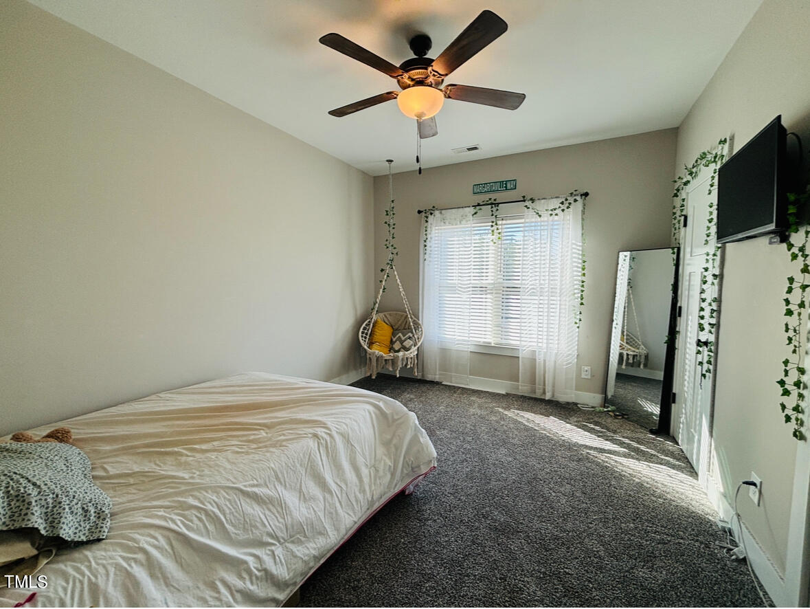 2510 Nc 55 Dunn, NC 28334 - Photo 9 of 13 a bed room with a bed and a television