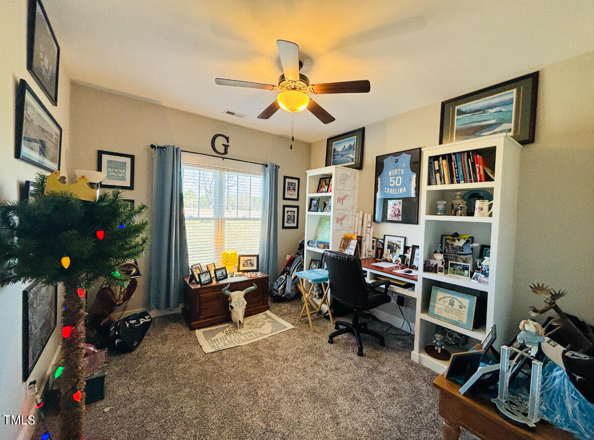 2510 Nc 55 Dunn, NC 28334 - Photo 10 of 13 a living room with furniture a window and a flat screen tv
