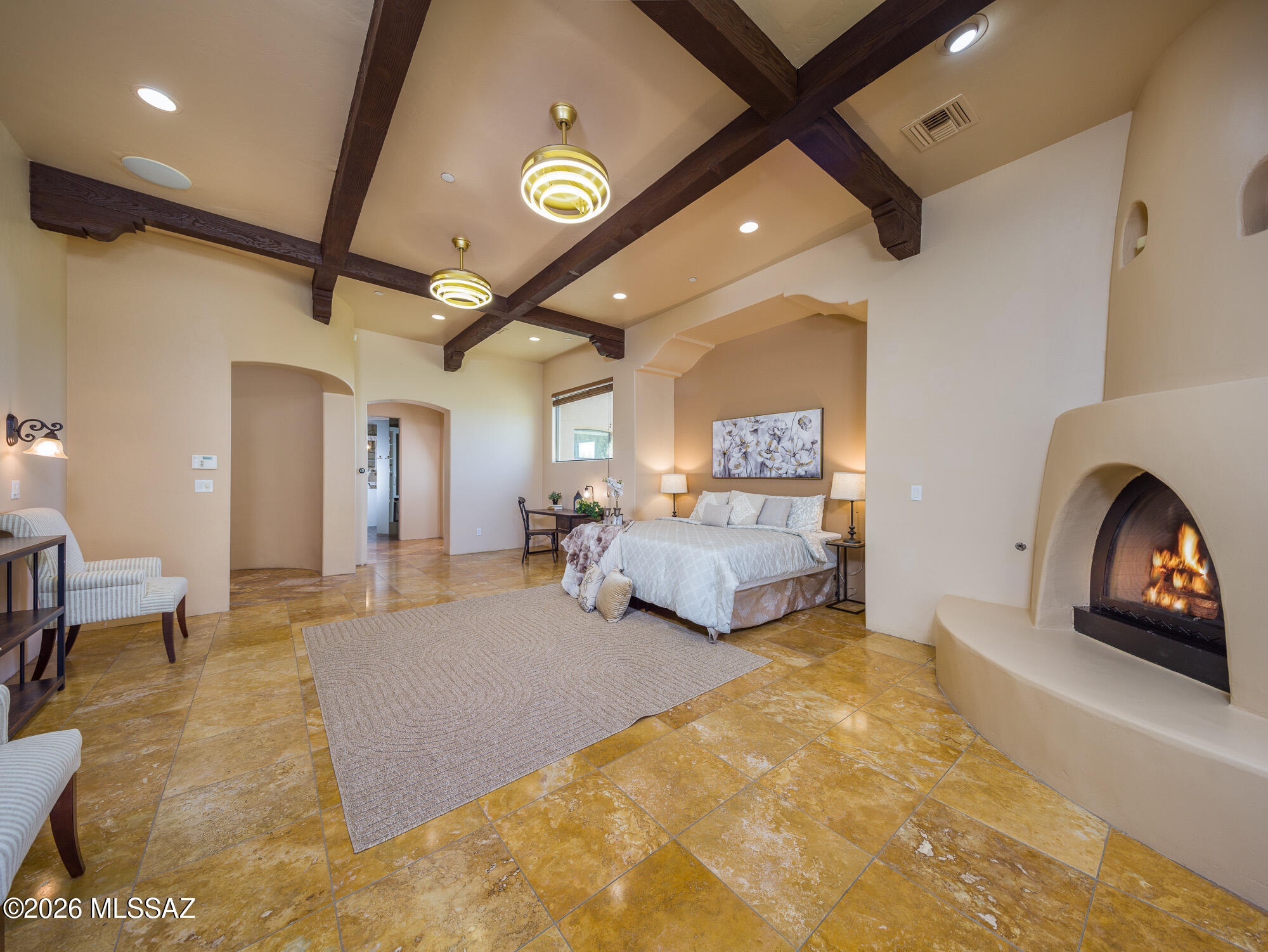 14225 North Rocking Ridge Court Marana, AZ 85658 - Photo 18 of 51 Primary suite fireplace