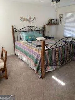 a bedroom with a bed and cabinets