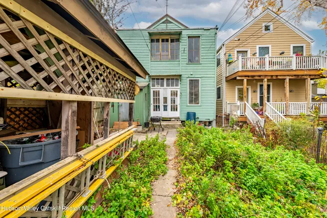 a front view of residential houses with yard