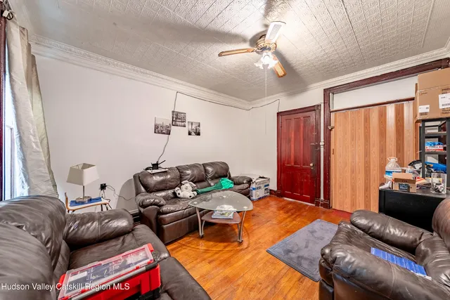 a bedroom with furniture and a chandelier